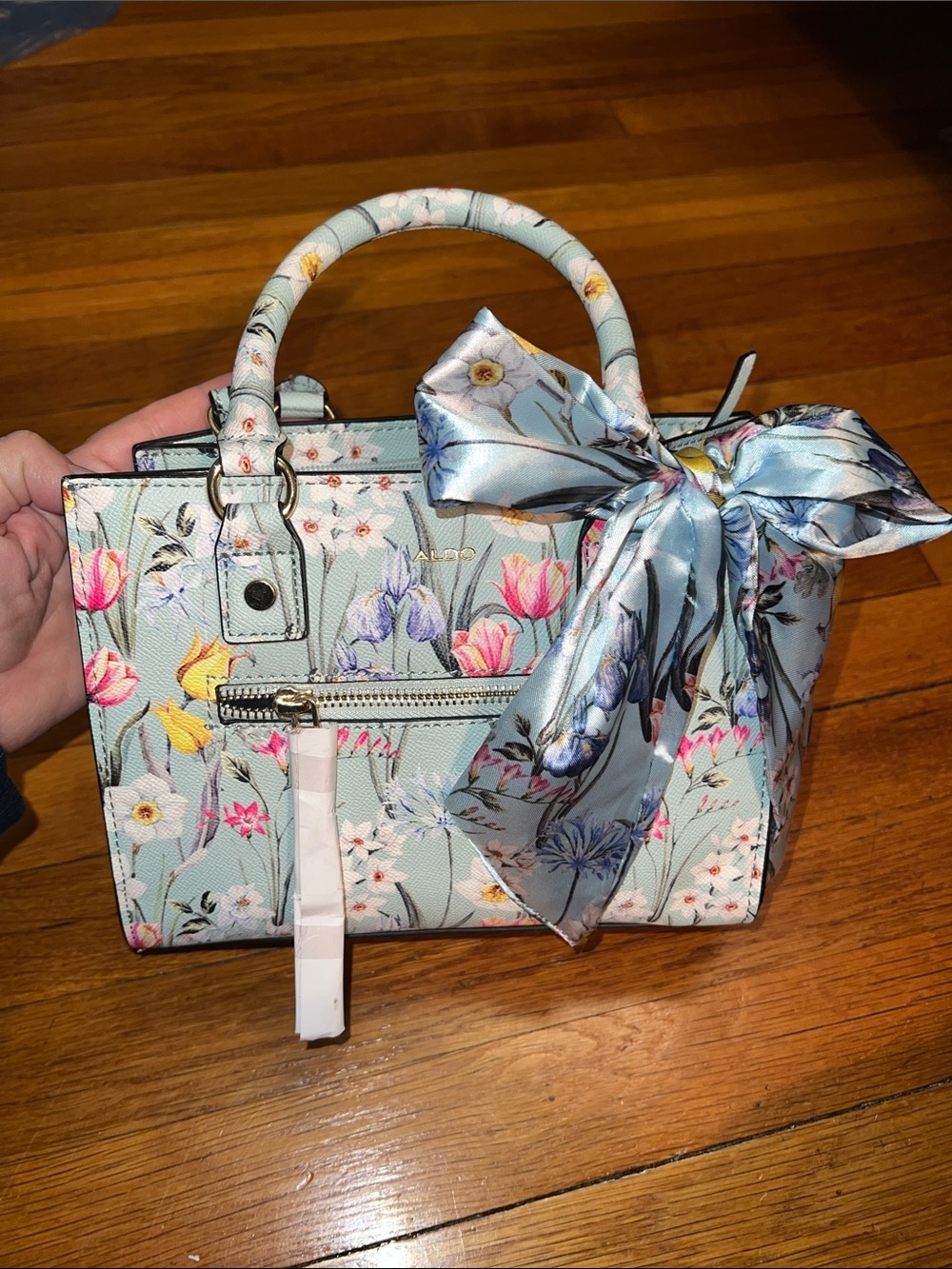 Aldo Floral Satchel in Light Blue with Floral Accents
9” wide, 7” high, 4” deep